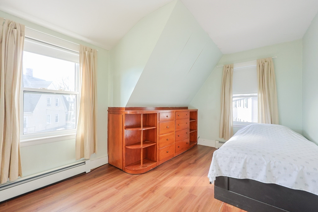 35 Miller Stile Road Quincy, MA 02169 - Photo 22 of 30 a bedroom with a bed and a window