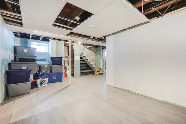 a view of a hallway with wooden walls