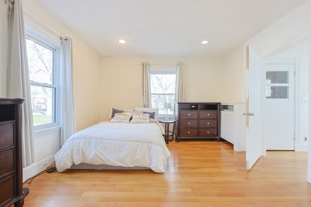 35 Miller Stile Road Quincy, MA 02169 - Photo 6 of 30 a bedroom with a bed and wooden floor