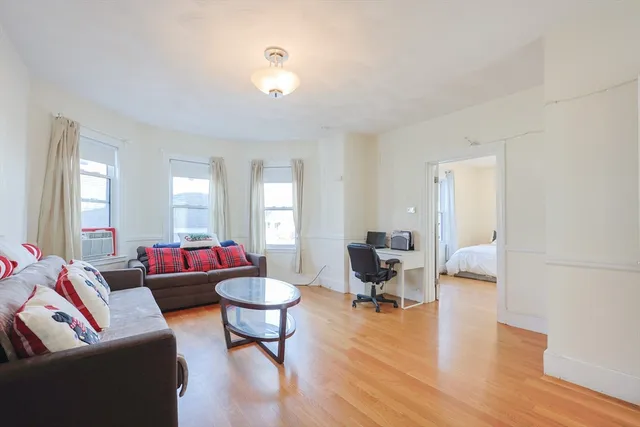 a living room with furniture and a table