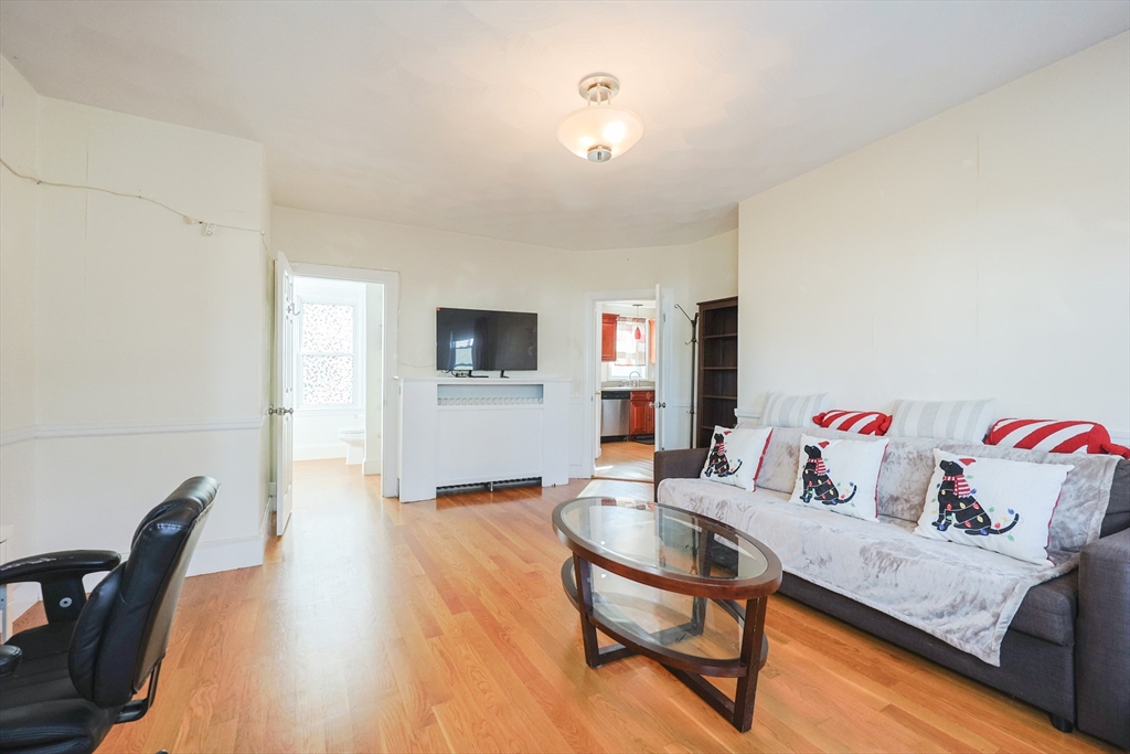 35 Miller Stile Road Quincy, MA 02169 - Photo 8 of 30 a living room with furniture and a flat screen tv