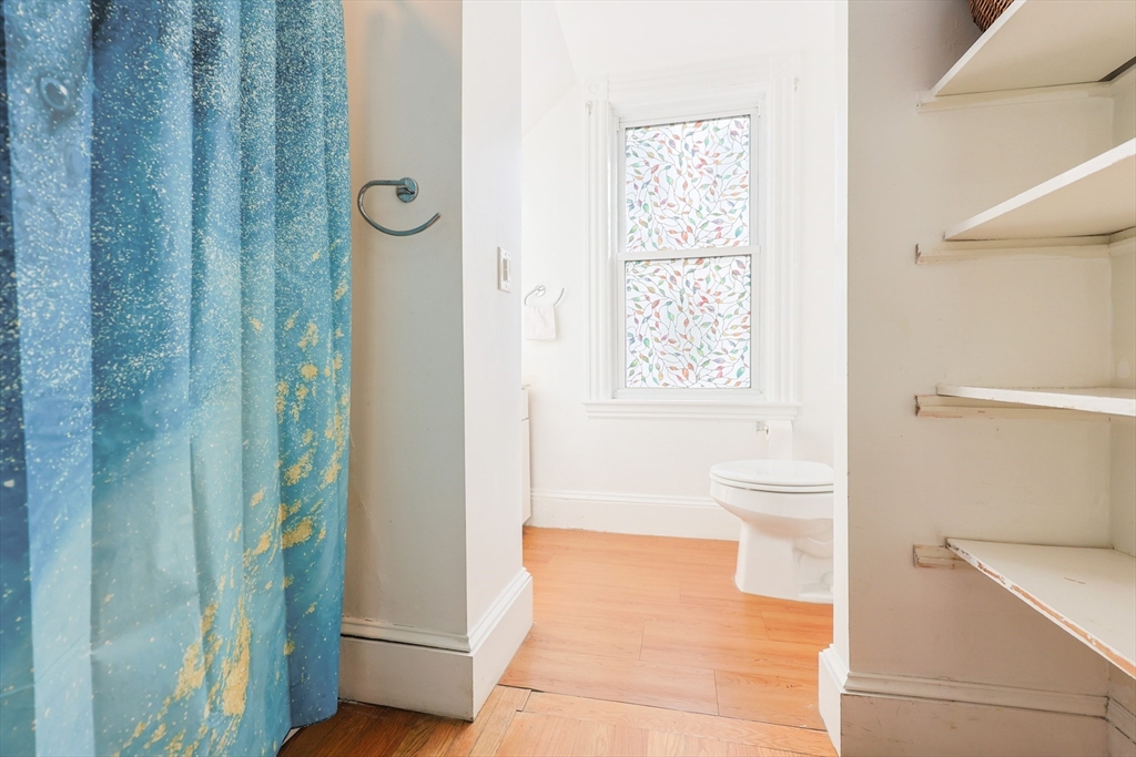 35 Miller Stile Road Quincy, MA 02169 - Photo 10 of 30 a bathroom with a toilet a sink and shower