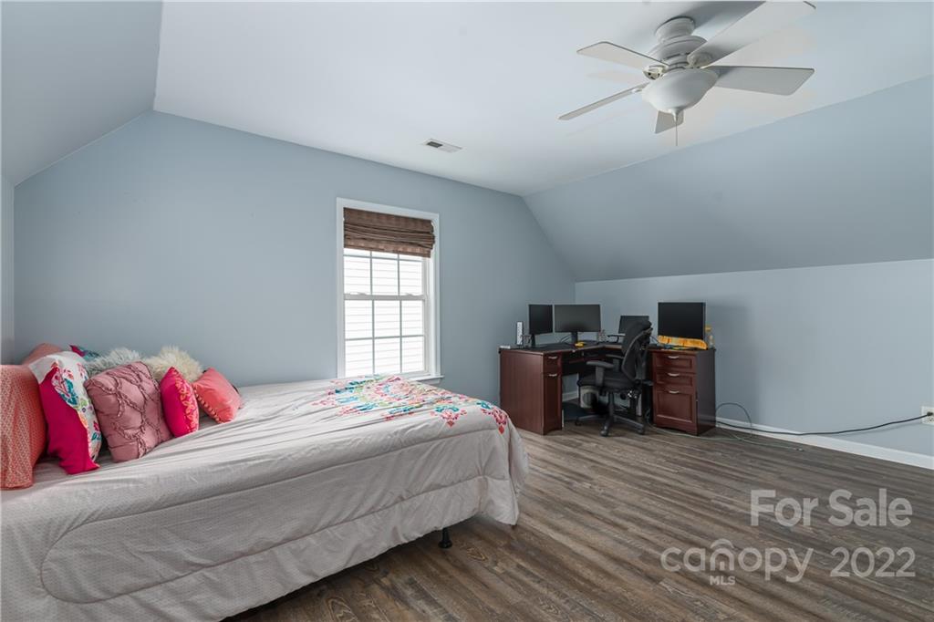11429 Chapeclane Road Charlotte, NC 28278 - Photo 14 of 26 a bedroom with a bed dresser and a window