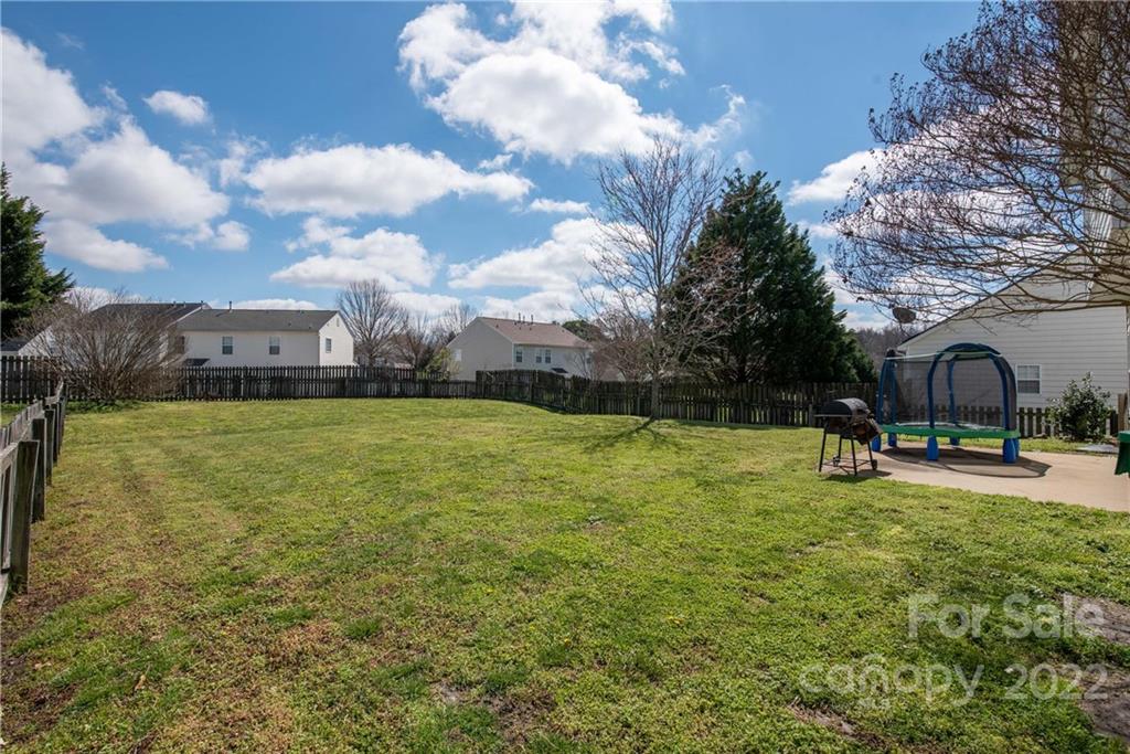 11429 Chapeclane Road Charlotte, NC 28278 - Photo 26 of 26 a view of a garden with a bench
