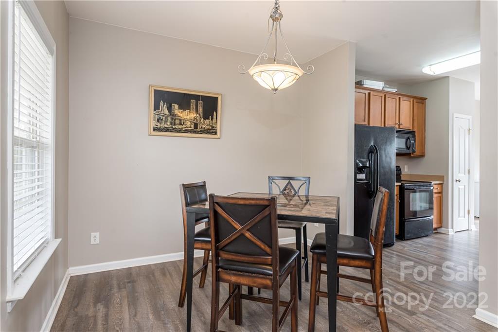 11429 Chapeclane Road Charlotte, NC 28278 - Photo 4 of 26 a view of a dining room with furniture and a window
