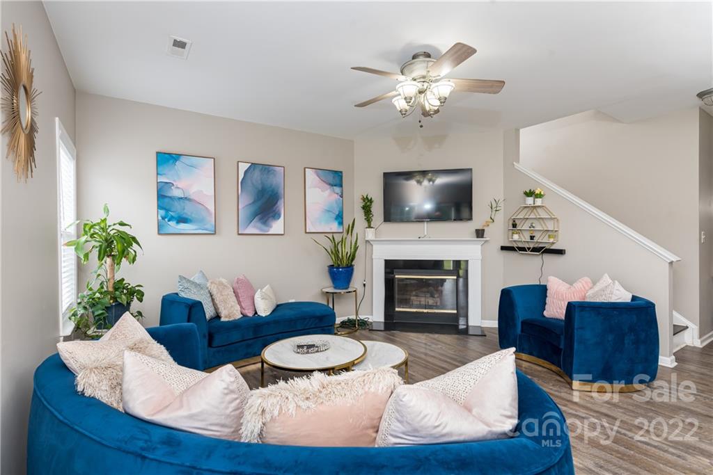 11429 Chapeclane Road Charlotte, NC 28278 - Photo 10 of 26 a living room with furniture a fireplace and a flat screen tv