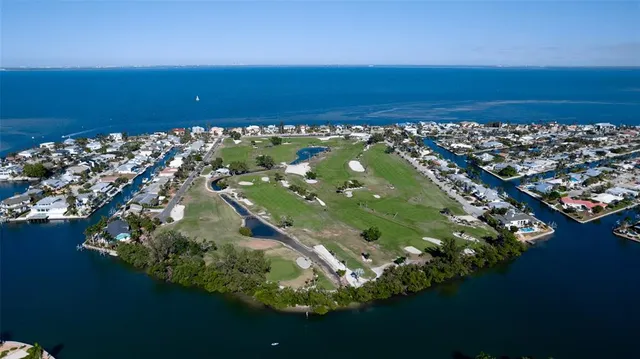 an aerial view of a house with a lake view