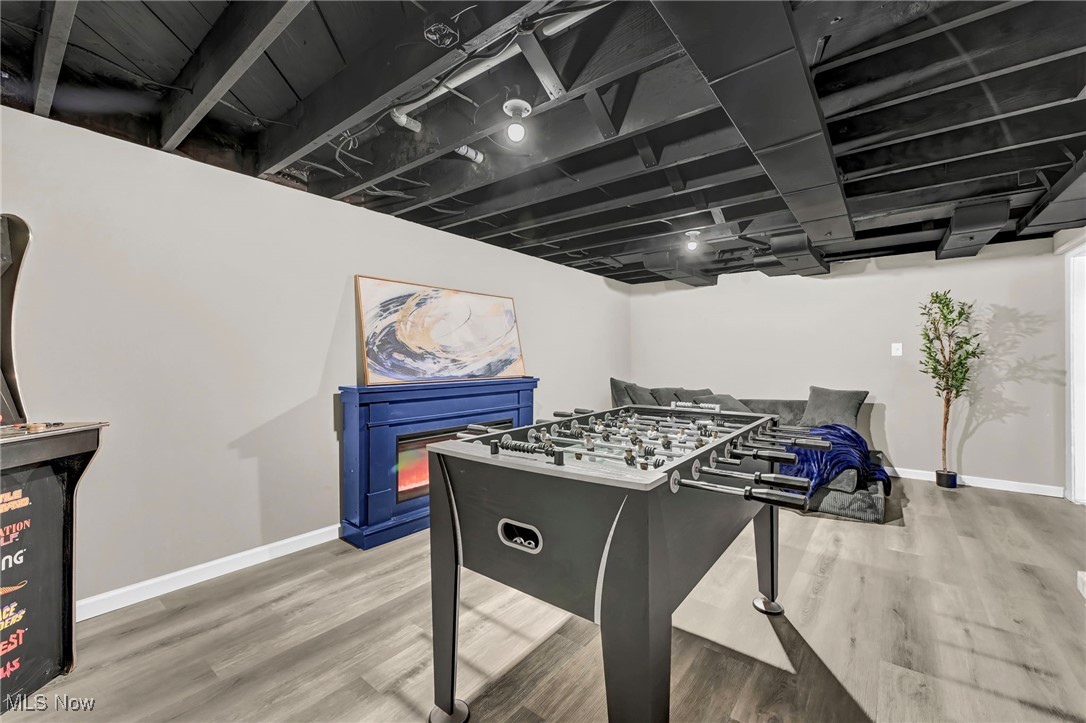 1731 Berger Road Akron, OH 44312 - Photo 28 of 37 Recreation room with finished floors and electric fireplace
