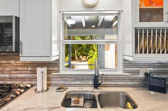 a kitchen with a sink and a window