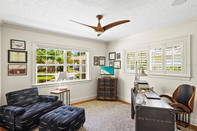 a bedroom with a bed and chair