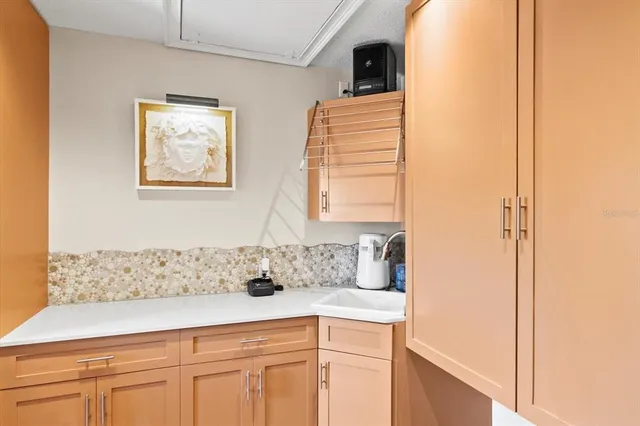 a large kitchen with a table and chairs