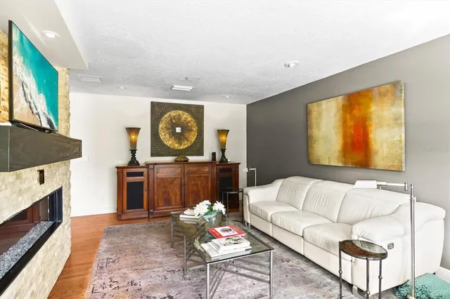 a front view of a building with a garden