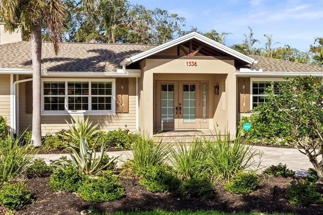 a front view of a house with garden