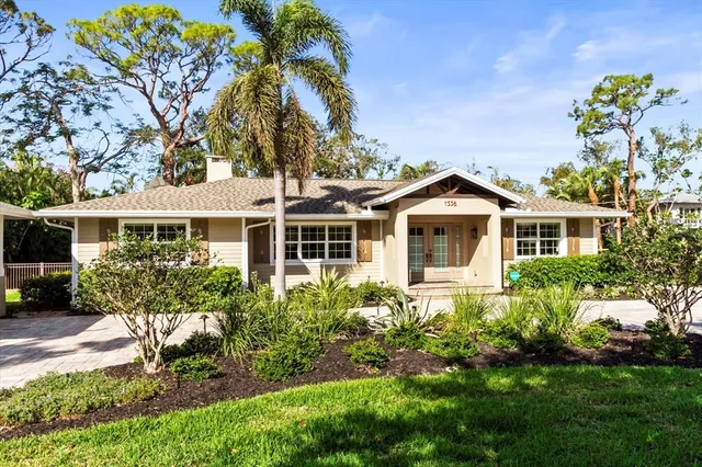 a front view of a house with a yard and porch
