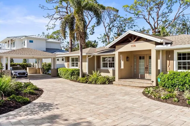 a view of a chair and tables in the garden