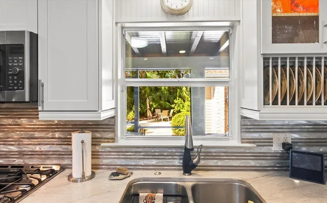 a kitchen with a sink and a window