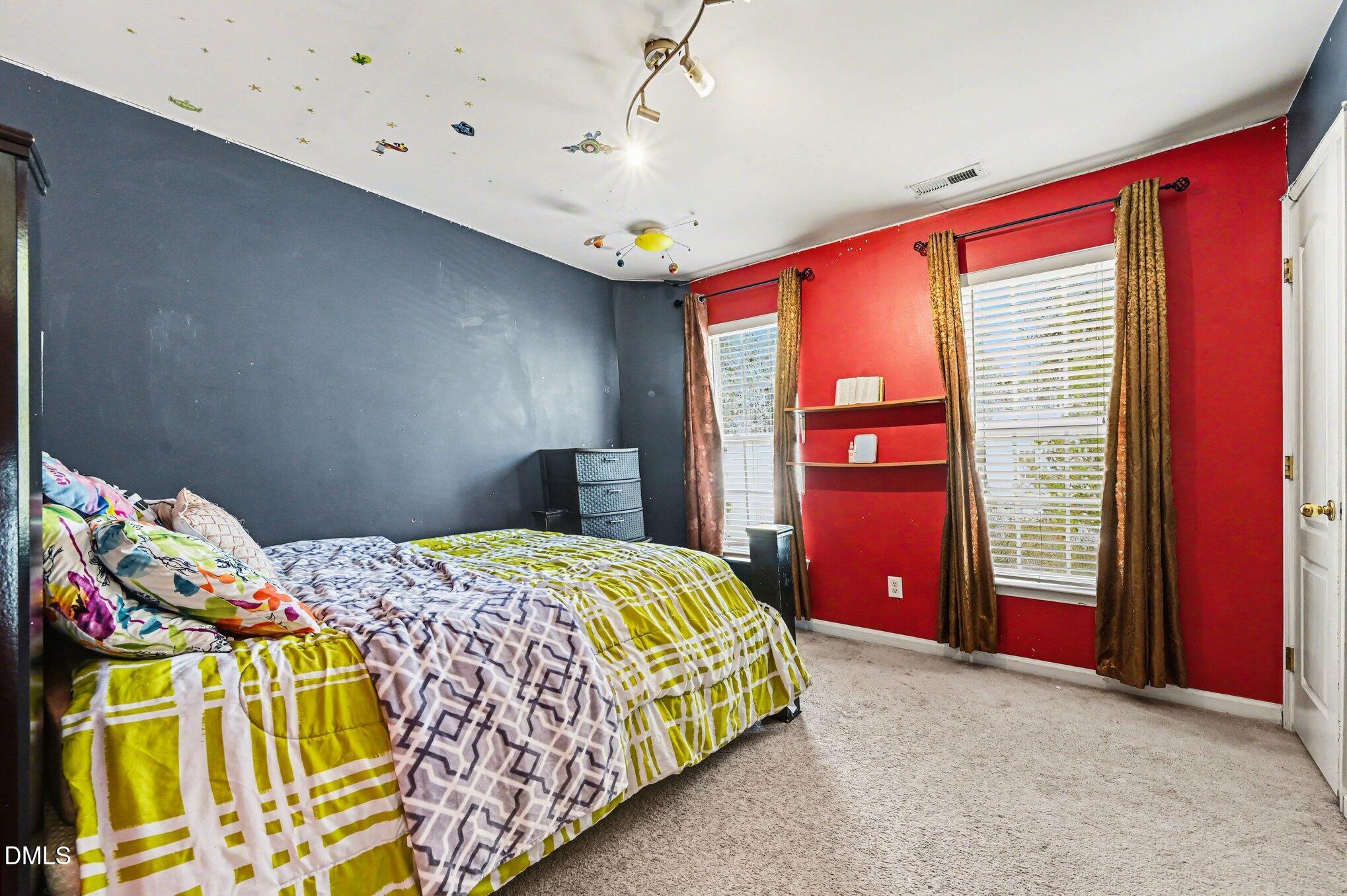 5115 Cardinal Grove Boulevard Raleigh, NC 27616 - Photo 15 of 36 a bedroom with a bed and a window
