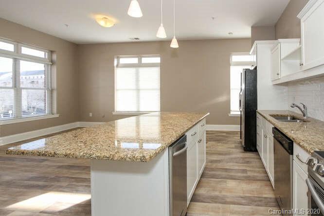 1700 Camden Road, Unit 201 Charlotte, NC 28203 - Photo 11 of 30 a kitchen with stainless steel appliances granite countertop a sink and a stove