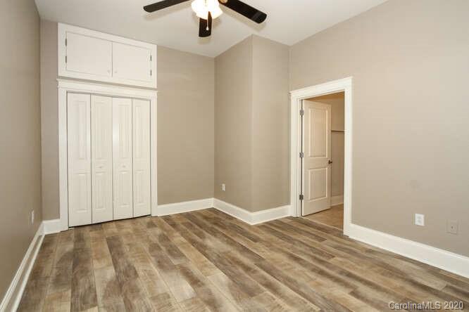 1700 Camden Road, Unit 201 Charlotte, NC 28203 - Photo 12 of 30 an empty room with chandelier fan