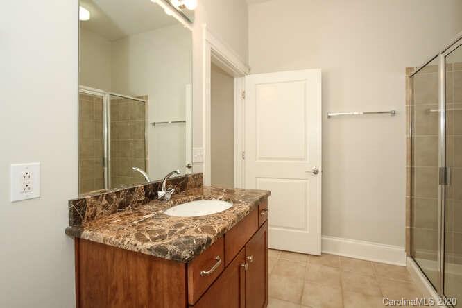 1700 Camden Road, Unit 201 Charlotte, NC 28203 - Photo 16 of 30 a bathroom with a sink and a mirror