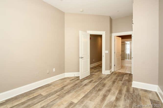 1700 Camden Road, Unit 201 Charlotte, NC 28203 - Photo 19 of 30 a view of a room with wooden floor