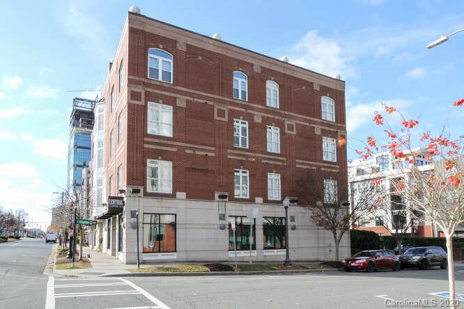 1700 Camden Road, Unit 201 Charlotte, NC 28203 - Photo 29 of 30 a front view of a building with lot of cars and trees