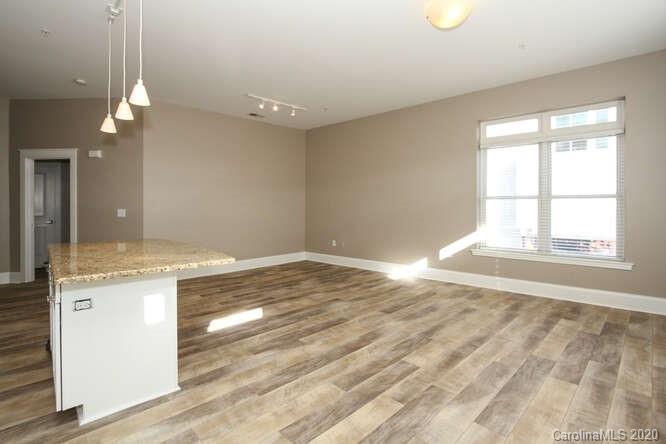 1700 Camden Road, Unit 201 Charlotte, NC 28203 - Photo 9 of 30 a view of a kitchen and a window chandelier