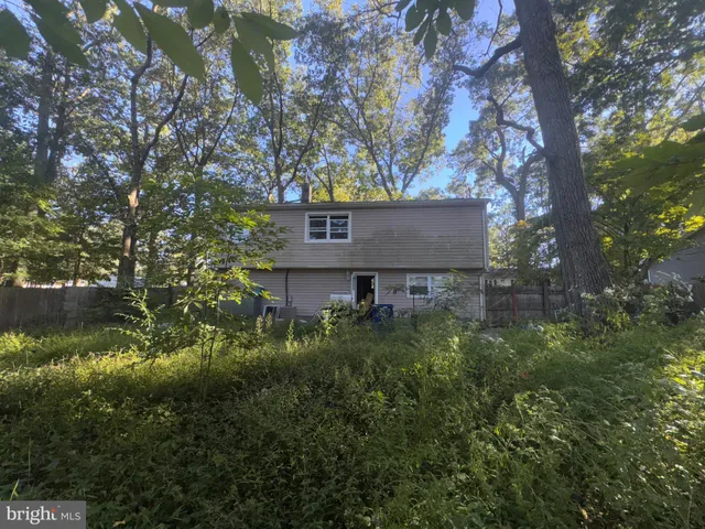 a view of a house with a tree