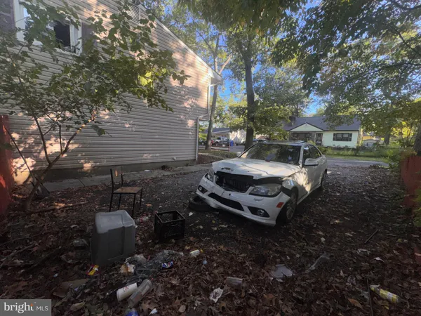 a view of a backyard with sitting area