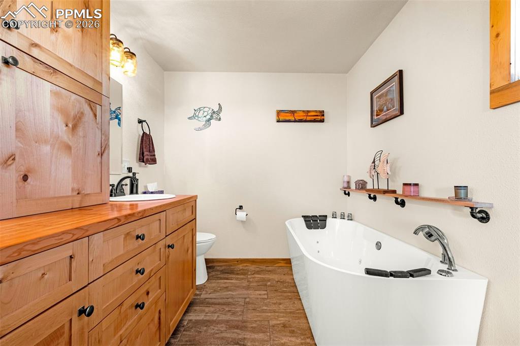 8480 Delaware Road Colorado Springs, CO 80926 - Photo 14 of 49 Primary bathroom with jetted tub and double vanity