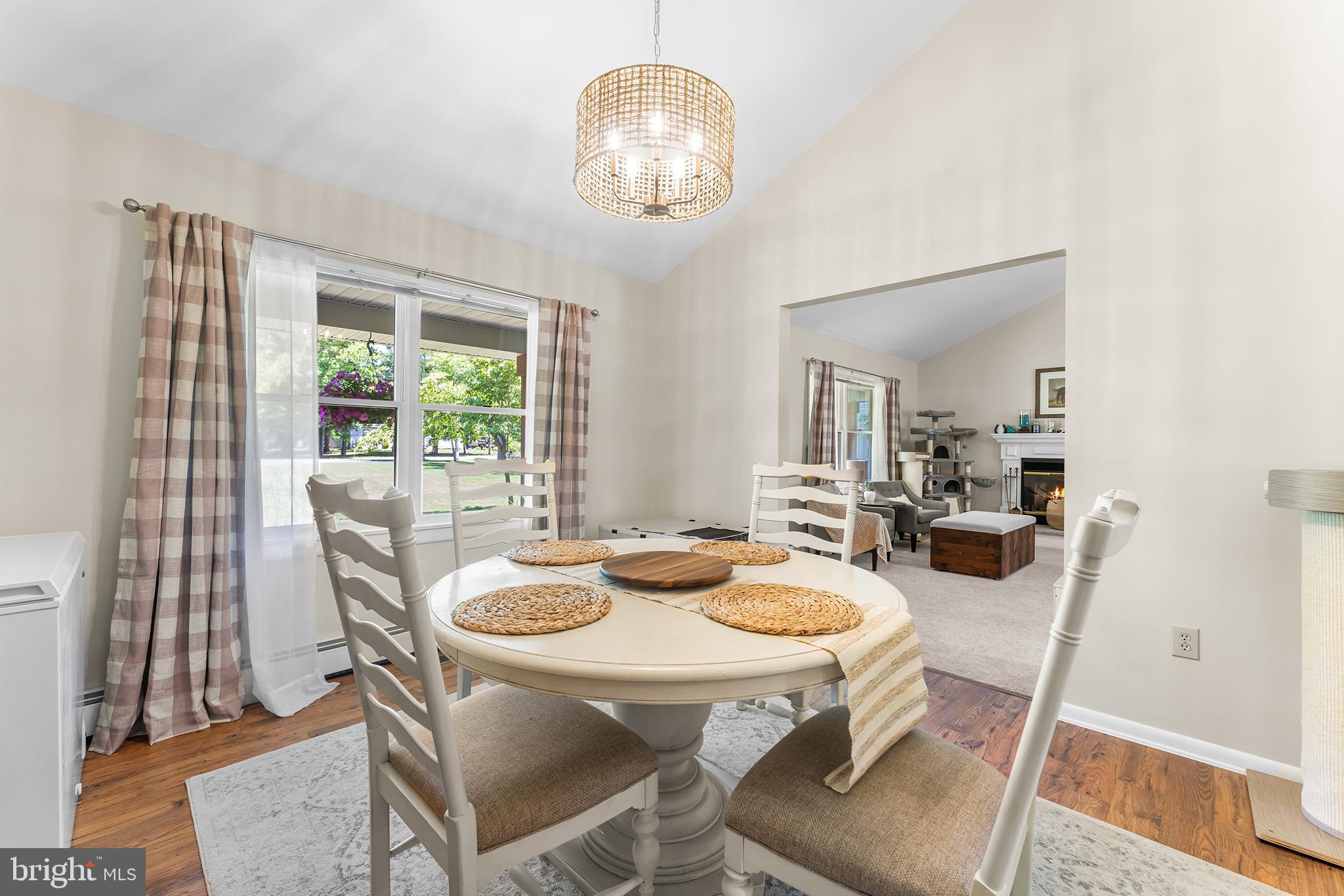 1431 Burleigh Road Cape May Court House, NJ 08210 - Photo 17 of 35 a dining room with furniture a chandelier and wooden floor
