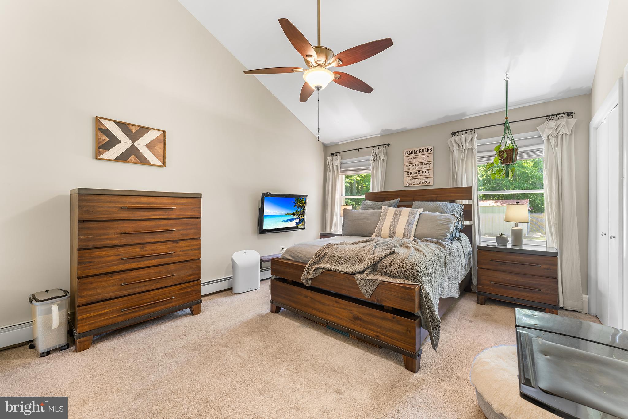 1431 Burleigh Road Cape May Court House, NJ 08210 - Photo 18 of 35 a bedroom with a bed and a ceiling fan