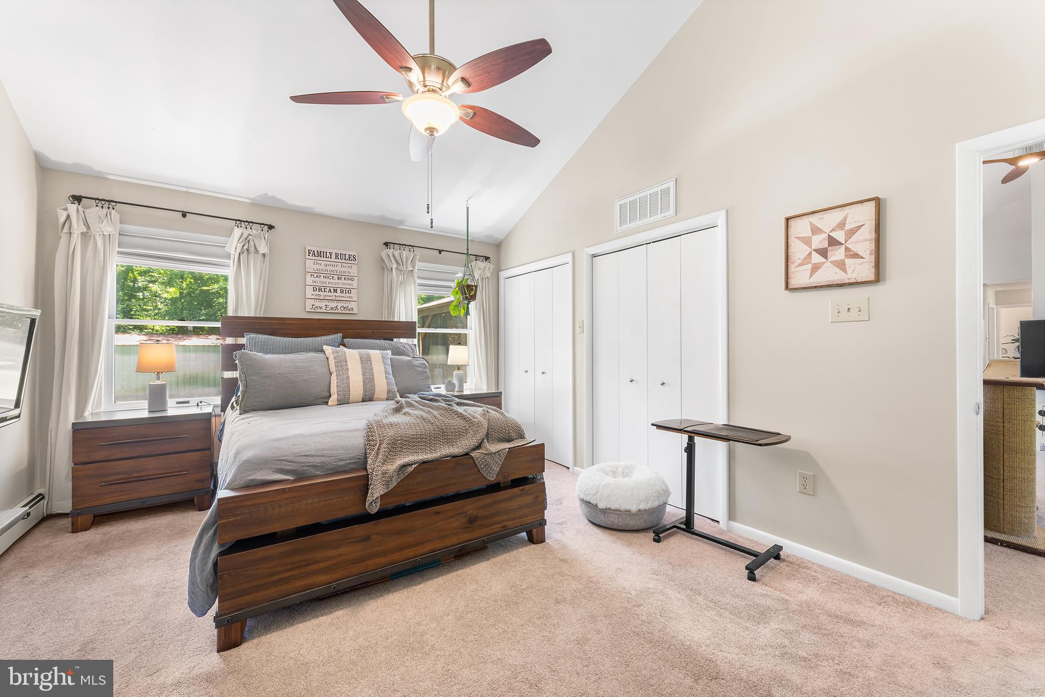 1431 Burleigh Road Cape May Court House, NJ 08210 - Photo 20 of 35 a spacious bedroom with a bed and a chandelier