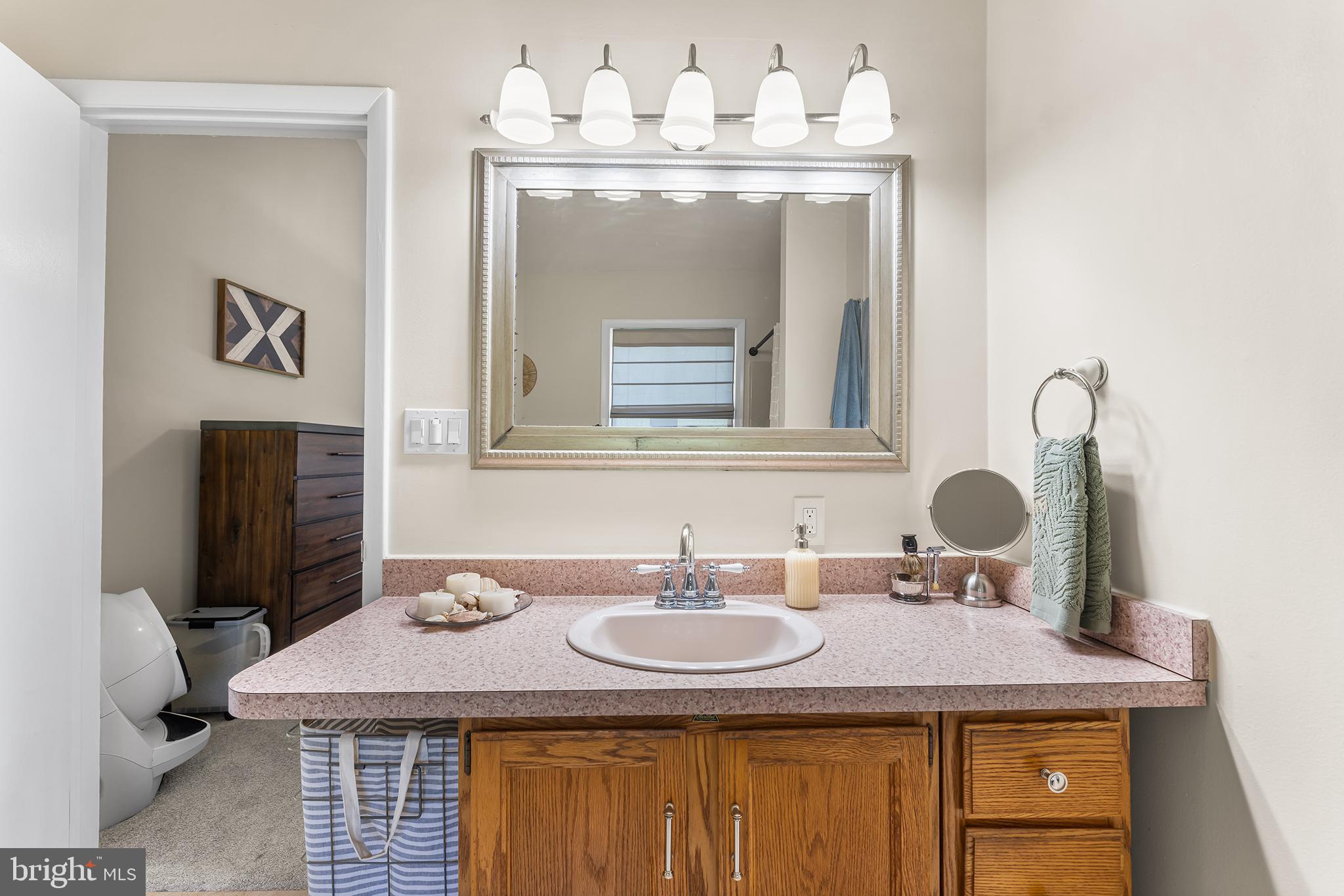 1431 Burleigh Road Cape May Court House, NJ 08210 - Photo 21 of 35 a bathroom with a sink and a mirror