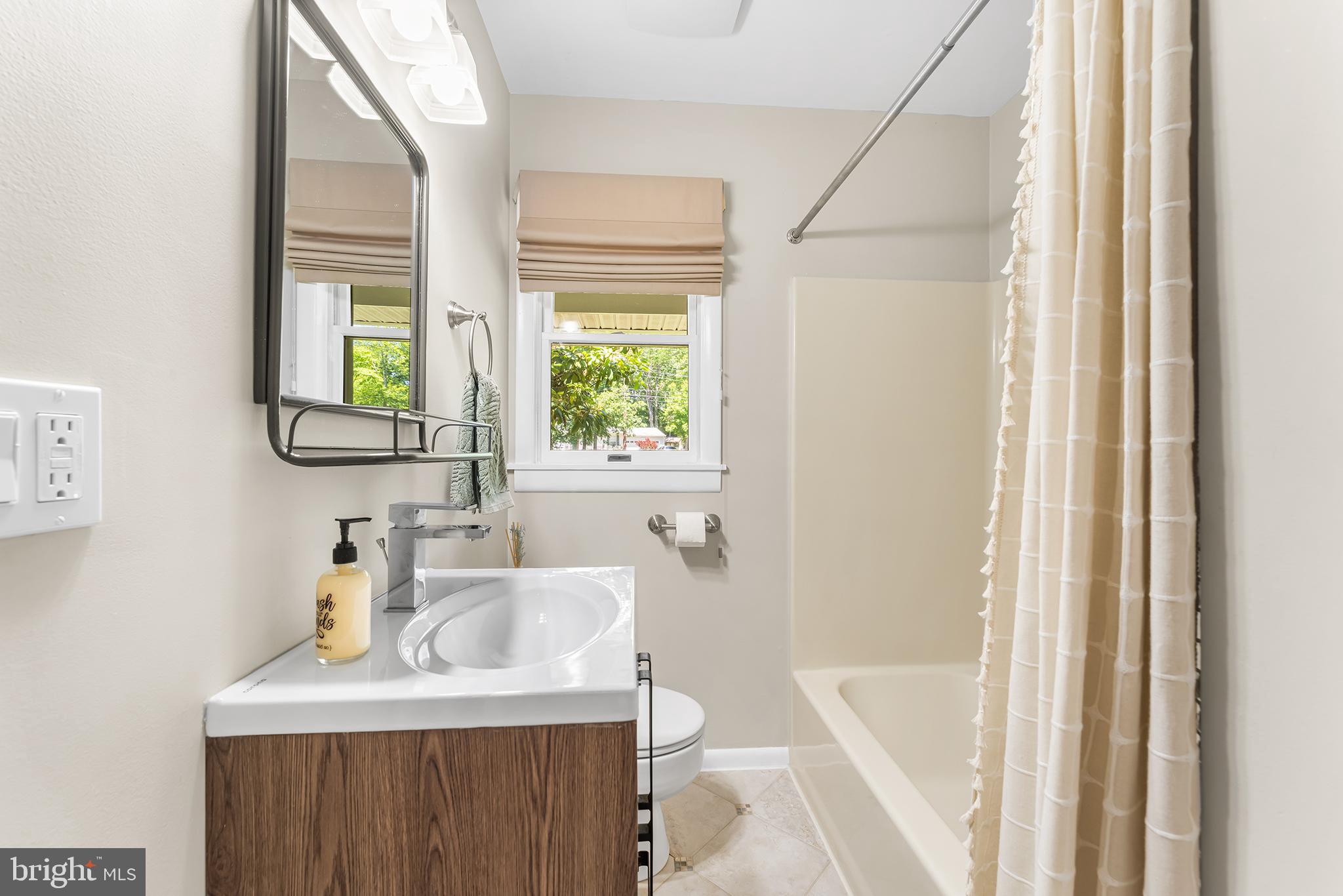 1431 Burleigh Road Cape May Court House, NJ 08210 - Photo 25 of 35 a bathroom with a sink and a bathtub