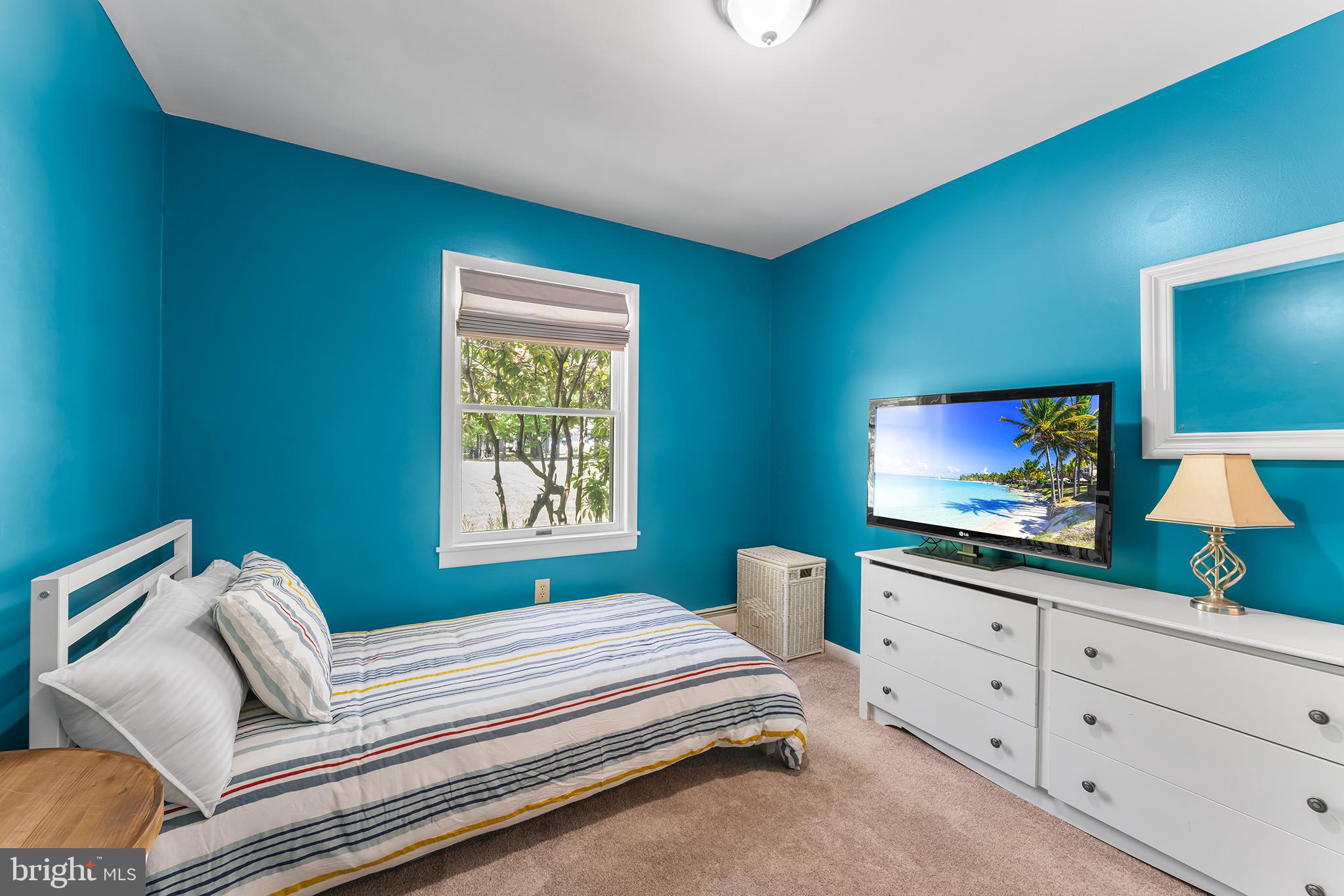 1431 Burleigh Road Cape May Court House, NJ 08210 - Photo 30 of 35 a bedroom with furniture and a flat screen tv