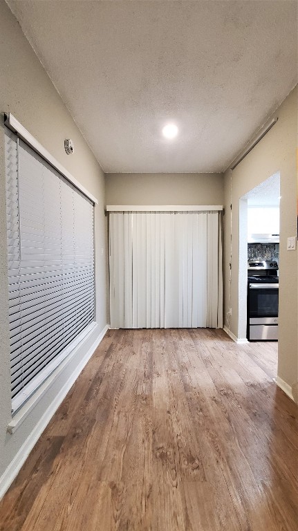 3768 Tanglewilde Street, Unit J5 Houston, TX 77063 - Photo 5 of 12 a view of an empty room with a window