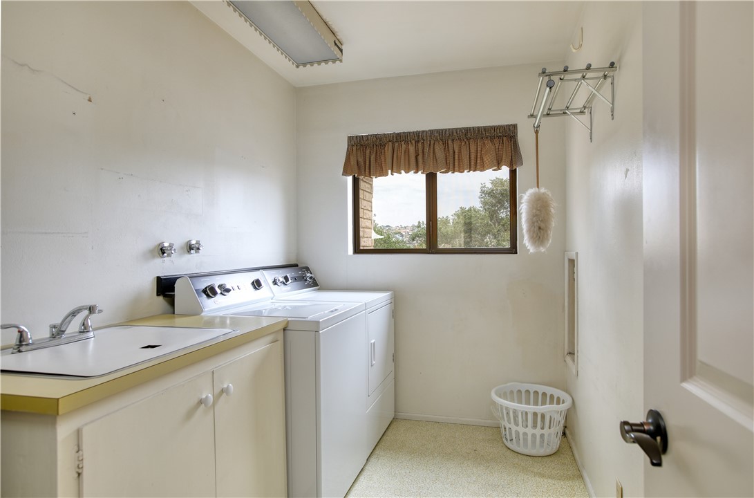 910 North 12th Street Grover Beach, CA 93433 - Photo 20 of 42 a utility room with a sink dryer and washer
