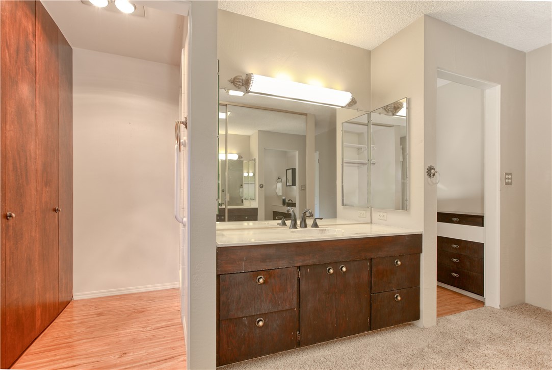 910 North 12th Street Grover Beach, CA 93433 - Photo 29 of 42 a bathroom with a double vanity sink and mirror with shower