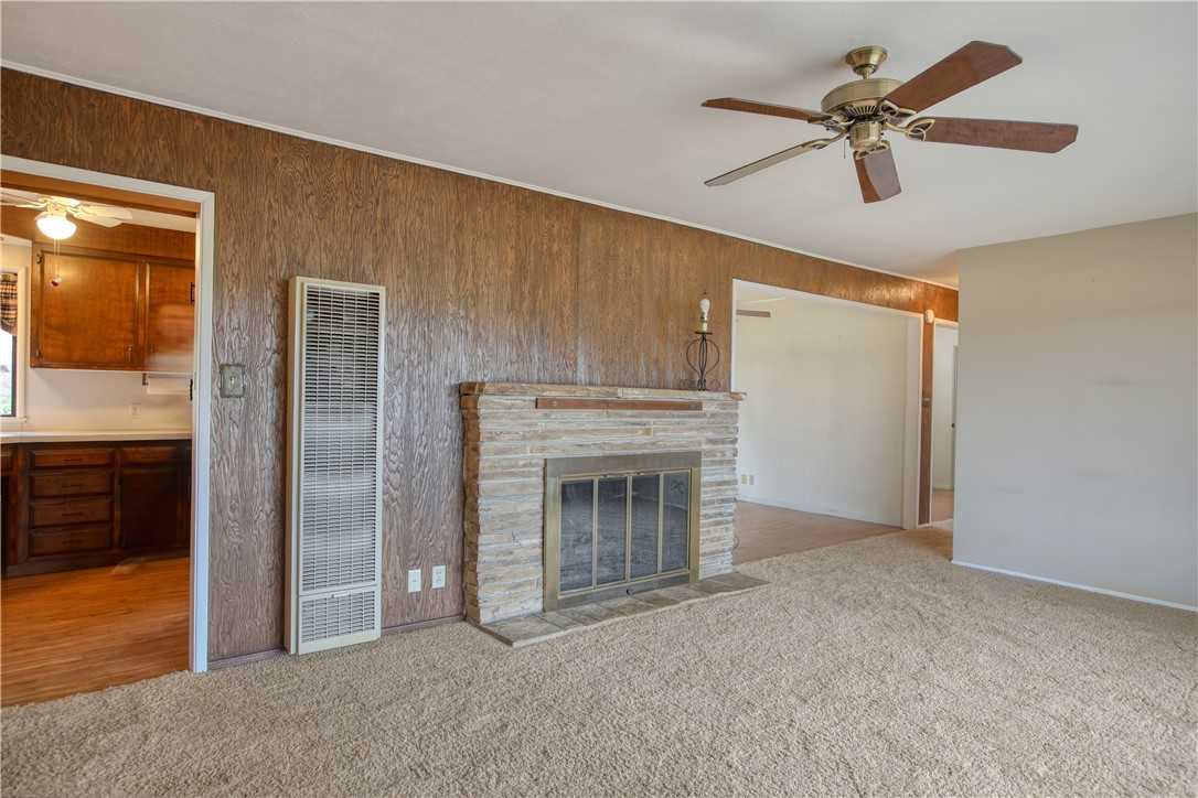 910 North 12th Street Grover Beach, CA 93433 - Photo 9 of 42 a view of empty room with cabinet and a fireplace