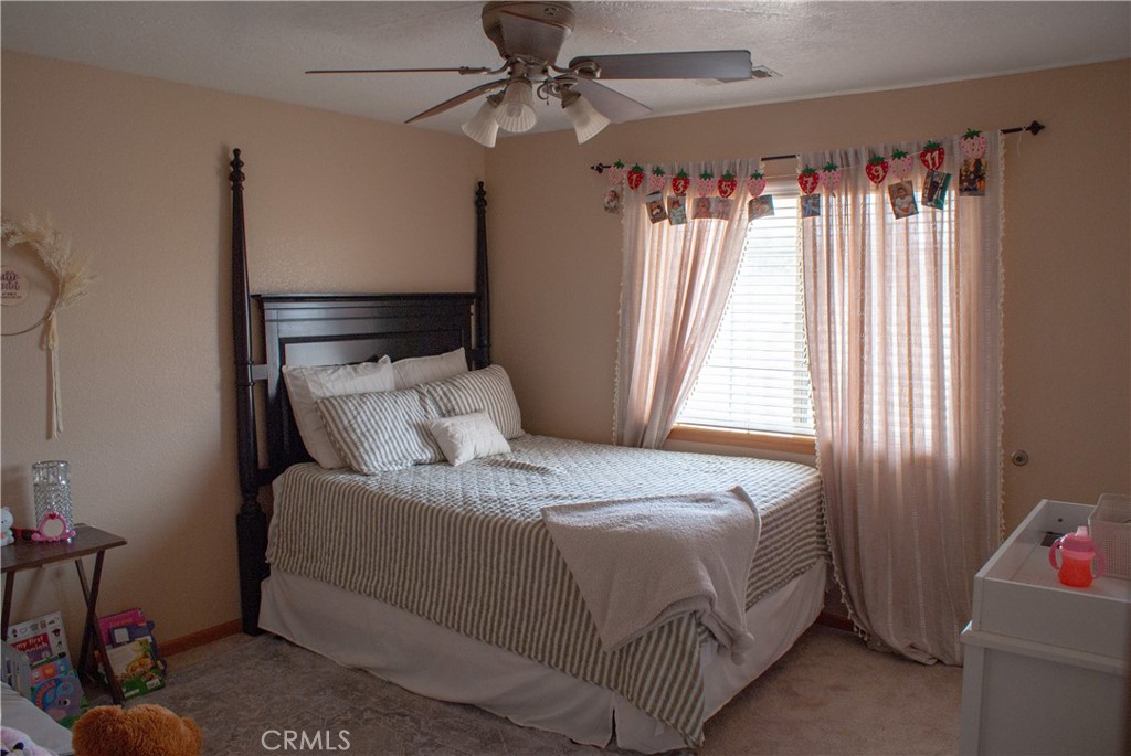 8465 Cedar Court Phelan, CA 92371 - Photo 18 of 51 a bedroom with a bed and a window