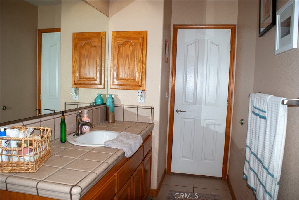 8465 Cedar Court Phelan, CA 92371 - Photo 20 of 51 a kitchen with a sink stove and cabinets
