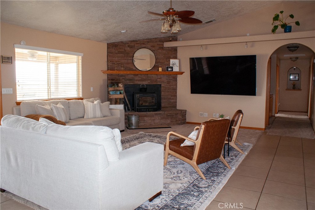 8465 Cedar Court Phelan, CA 92371 - Photo 23 of 51 a living room with furniture and a fireplace