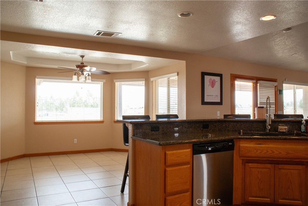 8465 Cedar Court Phelan, CA 92371 - Photo 37 of 51 a kitchen with granite countertop a sink and a granite counter tops