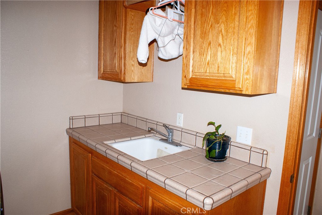 8465 Cedar Court Phelan, CA 92371 - Photo 42 of 51 a bathroom with a sink and a mirror