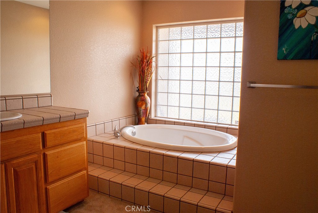 8465 Cedar Court Phelan, CA 92371 - Photo 49 of 51 a bathroom with a sink toilet and shower