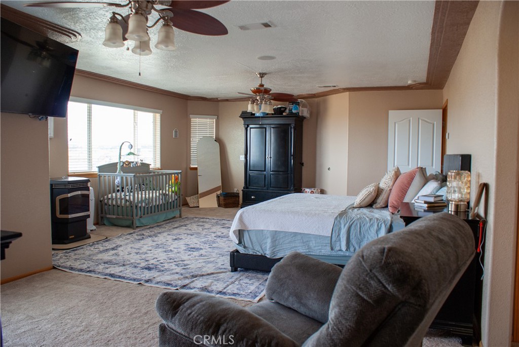 8465 Cedar Court Phelan, CA 92371 - Photo 50 of 51 a bed room with bed and television