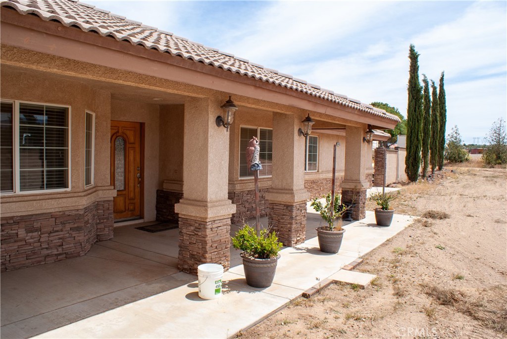 8465 Cedar Court Phelan, CA 92371 - Photo 5 of 51 a view of a house with potted plants