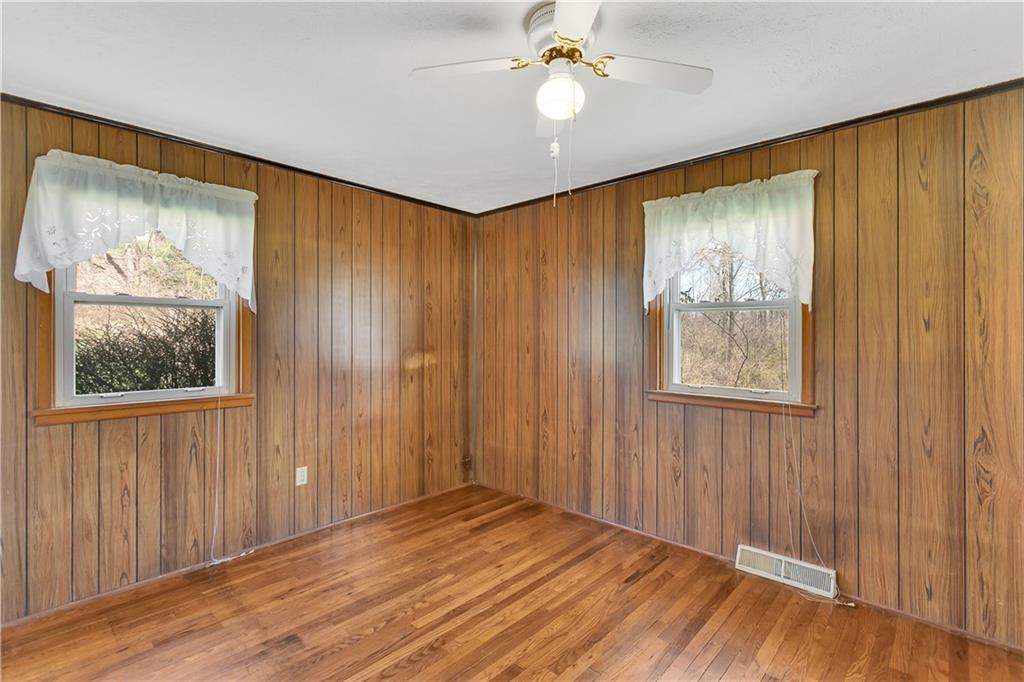 523 Allendale Road Rochester, PA 15074 - Photo 20 of 34 wooden floor in an empty room with a window