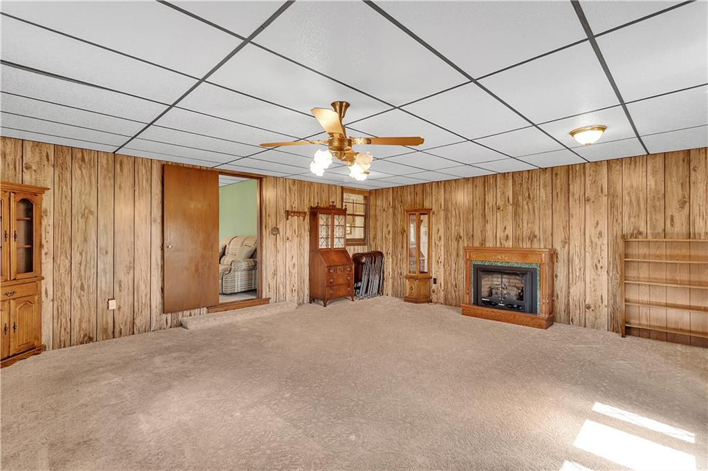 523 Allendale Road Rochester, PA 15074 - Photo 10 of 34 a view of an empty room with a fireplace and a window